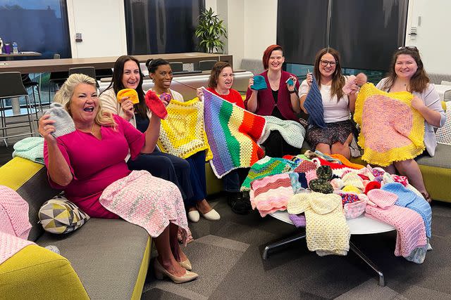 <p>WORLD WIDE TECHNOLOGY</p> A group at World Wide Technology takes up crocheting for a cause, making baby blankets and hats to donate to NICU at local and military hospitals.