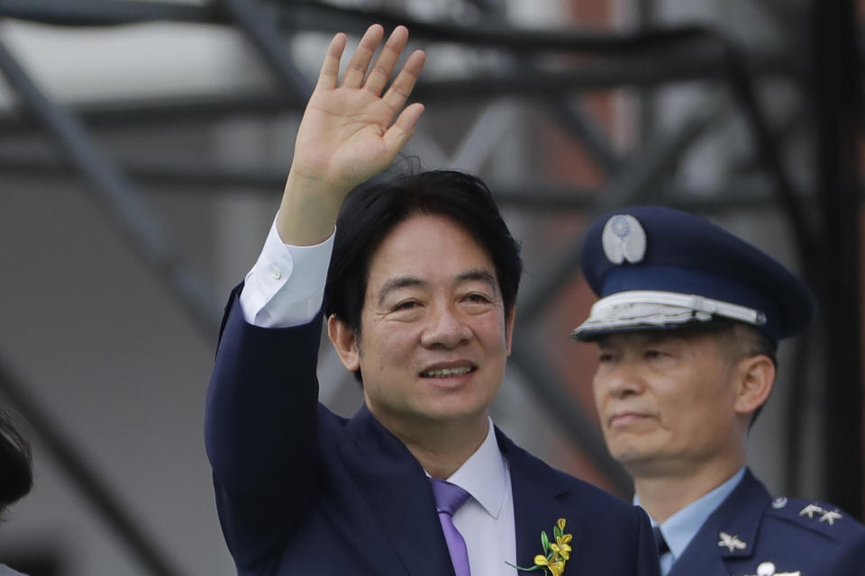 New Taiwan's President Lai Ching-te, with Vice President Hsiao Bi-khim, and former President Tsai Ing-wen, not in photo, waves during Lai's inauguration ceremonies in Taipei, Taiwan, Monday, May 20, 2024. (AP Photo/Chiang Ying-ying)