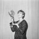 <p>Barbra Streisand shows off her Emmy victory. She earned the trophy for her television special <em>My Name is Barbra</em>. </p>