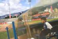 Baseball fans watch a game at University Stadium in Caracas