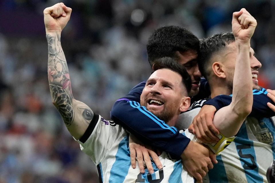 Lionel Messi celebrates victory over the Netherlands (AP)