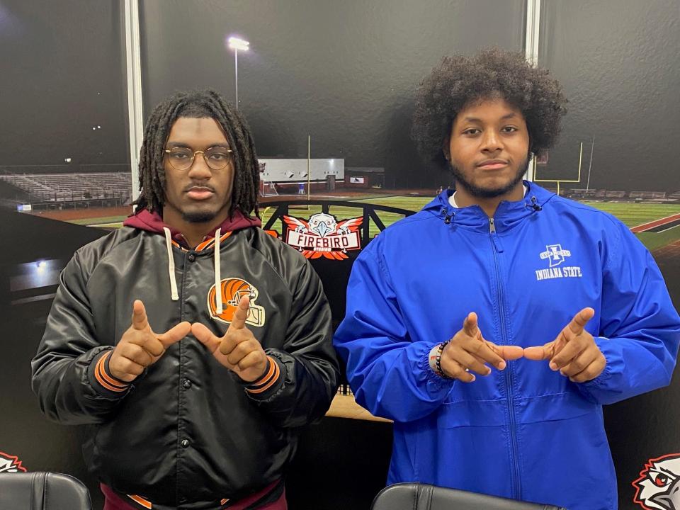 Lakota West football players signed their letters of intent to play college sports Feb. 2 at the school. They are, from left: Aden Miller,  University of Charleston; and Bryan Henderson, Indiana State University.