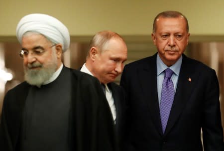 Presidents Rouhani of Iran, Erdogan of Turkey and Putin of Russia arrive for a news conference in Ankara