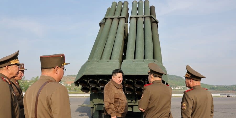 Kim Jong-un against the background of a new 240-mm multiple launch rocket system