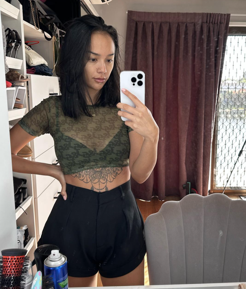 TikTok influencer Kat Clark in midriff top 