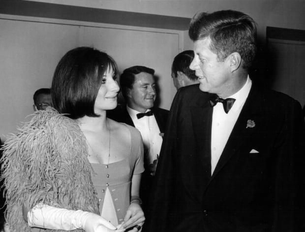 <p>With President John F. Kennedy in 1963. Photo: National Archive/Newsmakers</p>