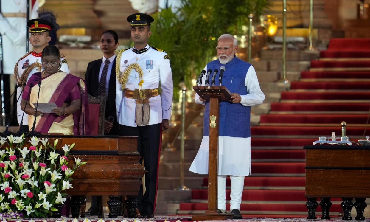 <span>Narendra Modi is sworn in as PM at the Rashtrapati Bhavan, in New Delhi.</span><span>Photograph: Manish Swarup/AP</span>