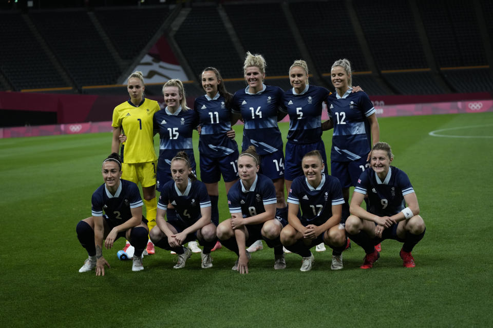 Britain's players pose for a team photo prior during a women's soccer match against Chile at the 2020 Summer Olympics, Wednesday, July 21, 2021, in Sapporo, Japan. (AP Photo/Silvia Izquierdo)