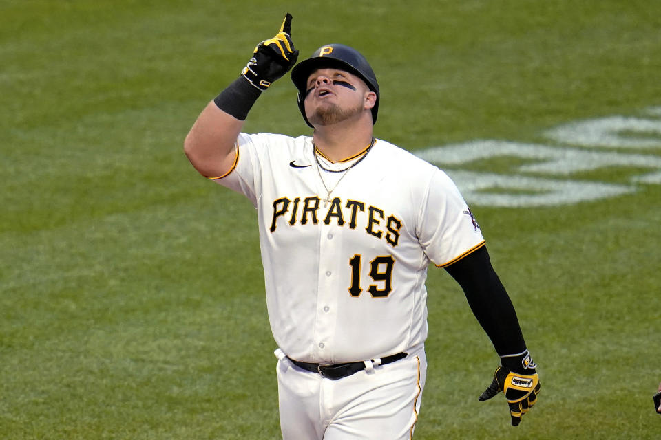 Pittsburgh Pirates' Daniel Vogelbach crosses home plate after hitting a solo home run off Cincinnati Reds starting pitcher Luis Castillo during the fourth inning of a baseball game in Pittsburgh, Saturday, May 14, 2022. (AP Photo/Gene J. Puskar)