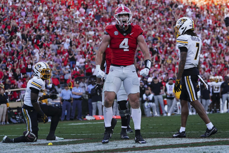 Georgia tight end Oscar Delp (4) reacts after catching a touchdown pass during the second half of an NCAA college football game against Missouri, Saturday, Nov. 4, 2023, in Athens, Ga. (AP Photo/John Bazemore)