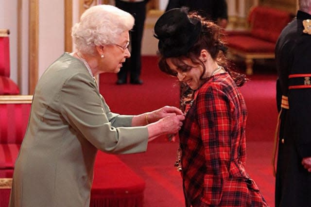 The Queen presented Helena Bonham Carter with her CBE in 2012 (Credit: PA)