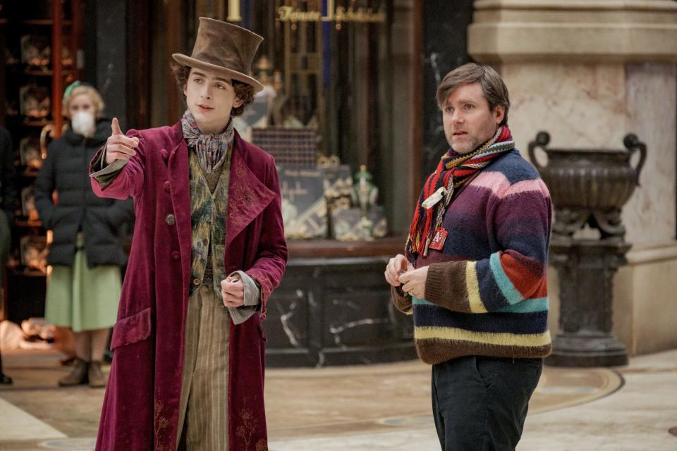 Timothée Chalamet, left, and director Paul King on the set of "Wonka."