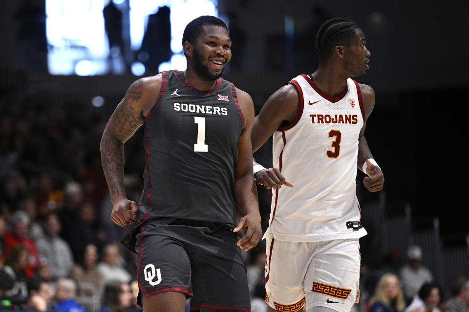 Nov 24, 2023; La Jolla, California, USA; Oklahoma Sooners forward John Hugley IV (1) smiles after a basket against the USC Trojans during the first half at LionTree Arena. Mandatory Credit: Orlando Ramirez-USA TODAY Sports