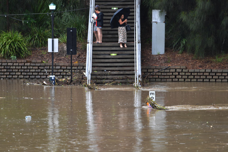 Floodwaters inundate the Parramatta Ferry jetty on the Parramatta River in Sydney, Tuesday. Source: AAP