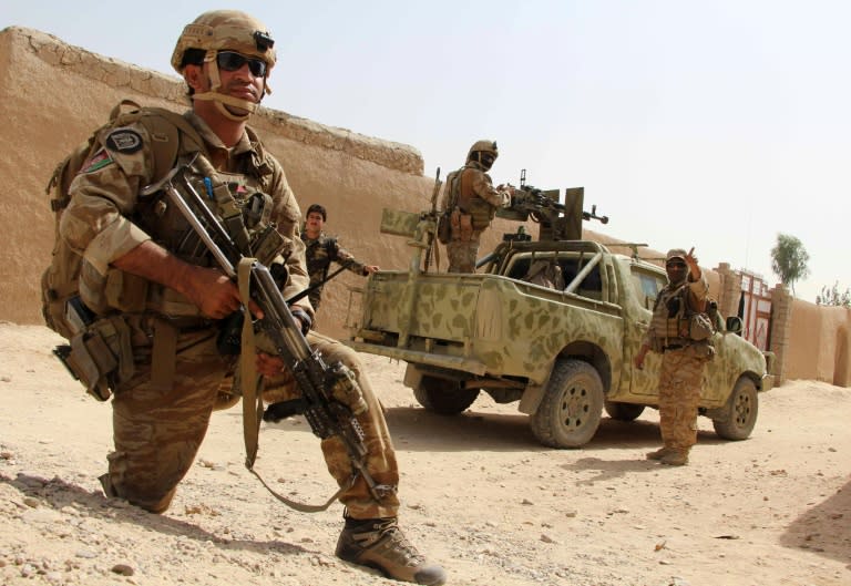 Afghan National Army commandos take position during a military operation in Helmand province on October 2, 2016