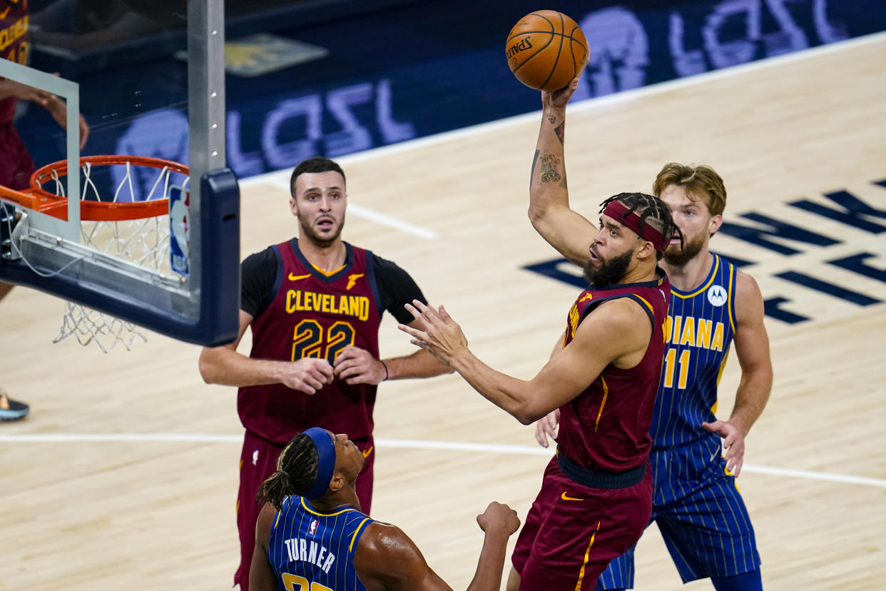 Cleveland Cavaliers center JaVale McGee (6) shoots over Indiana Pacers forward Myles Turner (33) during the second half of an NBA basketball game in Indianapolis, Thursday, Dec. 31, 2020. (AP Photo/Michael Conroy)