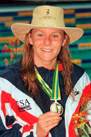 Dover's Jenny Thompson shows off the gold medal she won in the women's 100-meter butterfly final at the World Swimming Championships in Perth, Australia 1998.