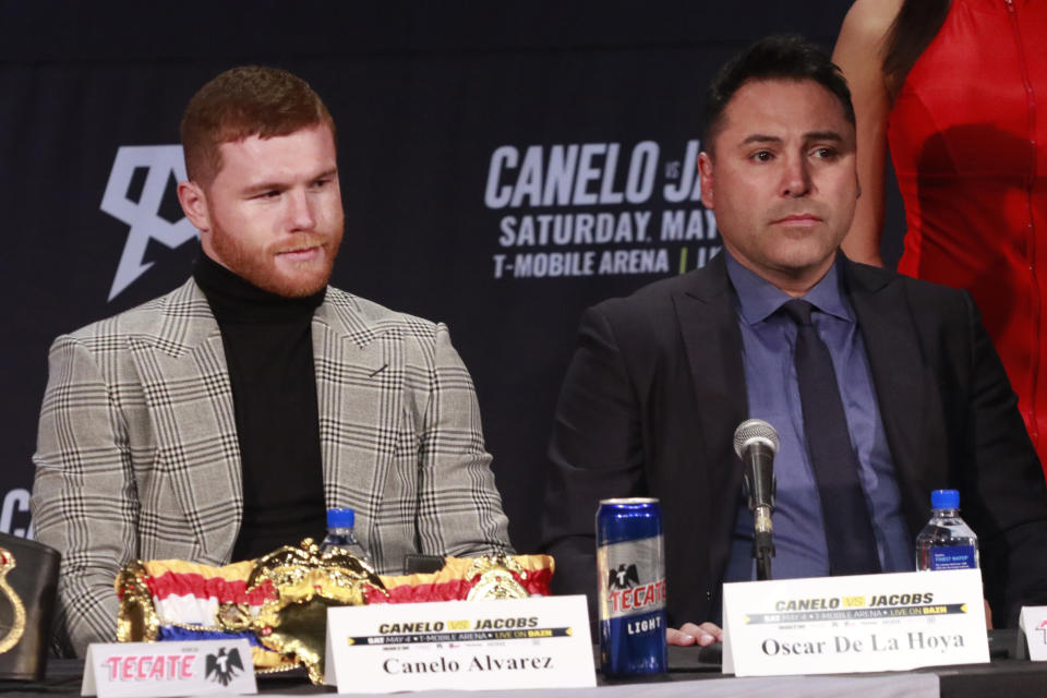 NEW YORK, NY - FEBRUARY 27: Chepo Ryenoso, Canelo Alvarez and Oscar De La Hoya at the Canelo Alvarez vs Daniel 'Miracle Man' Jacobs Middleweight Unification Fight Press Conference ahead of their May 4th , Cinco de Mayo weekend title fight. Hard Rock Times Square in New York City on February 27, 2019. Credit: Diego Corredor/MediaPunch /IPX