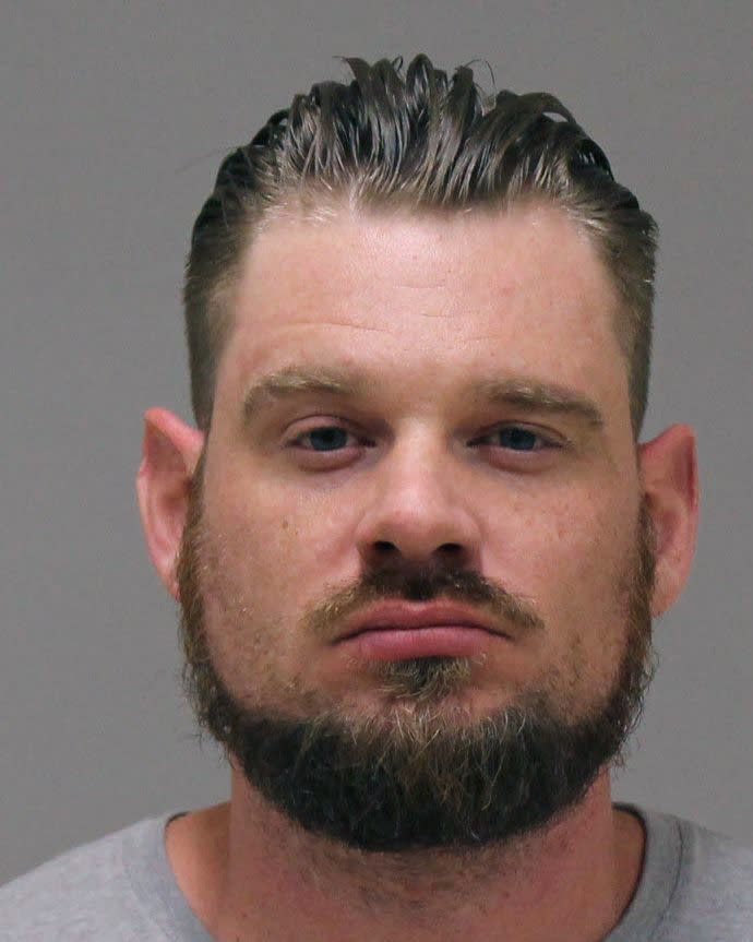 In a photo provided by the Kent County Sheriff, Adam Dean Fox is shown in a booking photo. Fox is one of several people charged with plotting to kidnap Michigan Democratic Gov. Gretchen Whitmer, authorities said Thursday, Oct. 8, 2020, in announcing charges in an alleged scheme that involved months of planning and even rehearsals to snatch Whitmer from her vacation home. (Kent County Sheriff via AP)