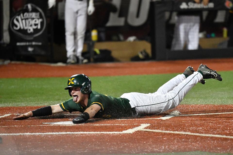 St. Xavier's Cooper Smith (3) slides into home to score during action of their Seventh Region Championship baseball game against Trinity, Sunday, May 29 2022 in Louisville Ky. St. Xavier won 11-0 after he game was called at the end of the fifth inning, and will now play for the state championship.