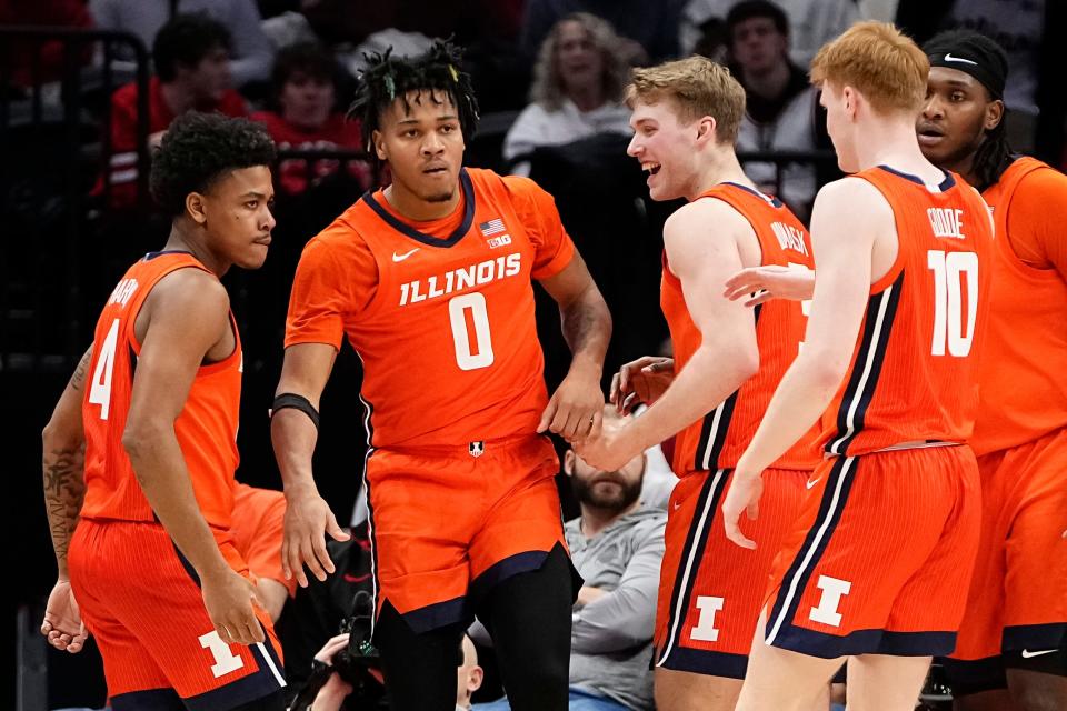 Feb 1, 2024; Columbus, Ohio, USA; Teammates react to a shot from Illinois Fighting Illini guard Terrence Shannon Jr. (0) during the second half of the NCAA men’s basketball game against the Ohio State Buckeyes at Value City Arena. Ohio State lost 87-75.