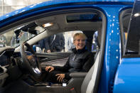 Energy Secretary Jennifer Granholm gets into the passenger seat for a demonstration of a Chevy Bolt EUV all electric vehicle during a visit to the Washington Auto Show in Washington, Wednesday, Jan. 25, 2023. (AP Photo/Andrew Harnik)