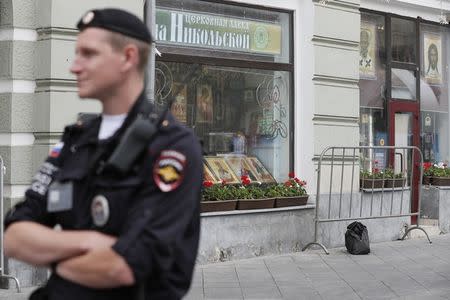 A suspicious bag is pictured on a blocked street near the Kremlin that has become a popular gathering place for World Cup in Moscow, Russia July 3, 2018. REUTERS/Gleb Garanich