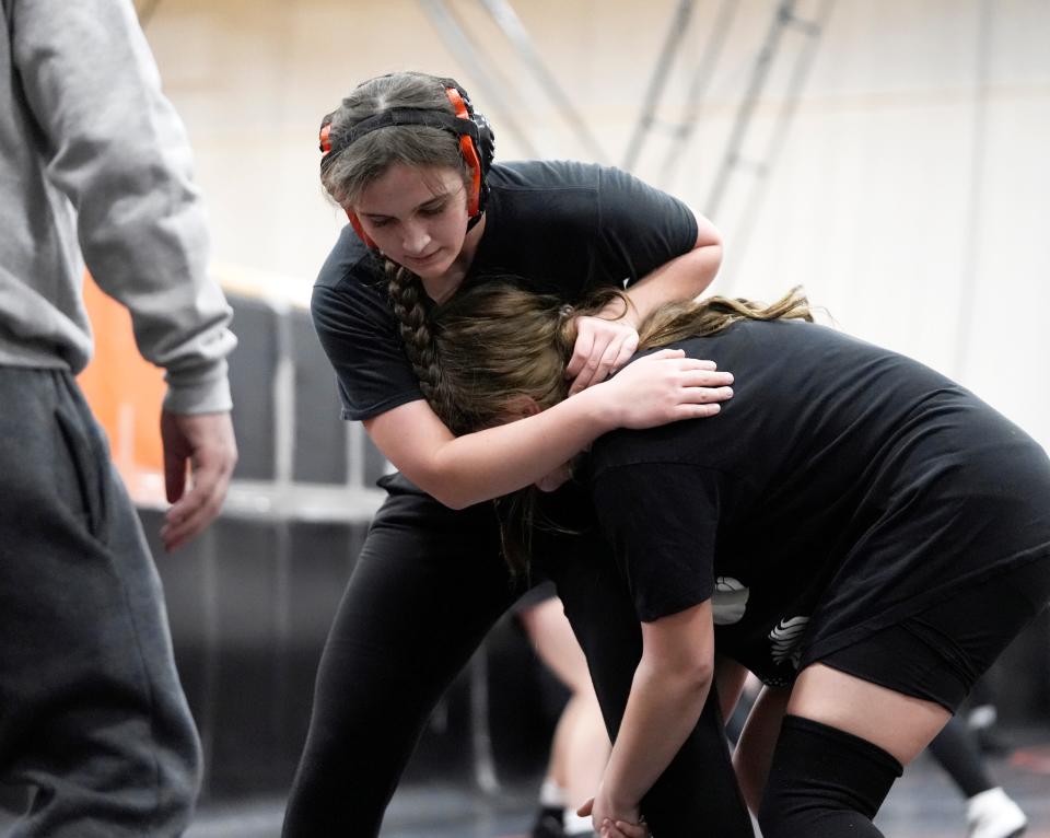 Delaware Hayes wrestler Evelyn Krauss spars with a teammate in practice on Wednesday.