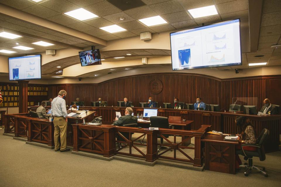 Coastal Health District Director Dr. Lawton Davis gives a COVID-19 update to the Chatham County commission, including newly elected members Larry “Gator” Rivers, Tanya Milton, Aaron Whitely, Kenneth Adams and new Chairman Chester Ellis. [Richard Burkhart/Savannah Morning News]