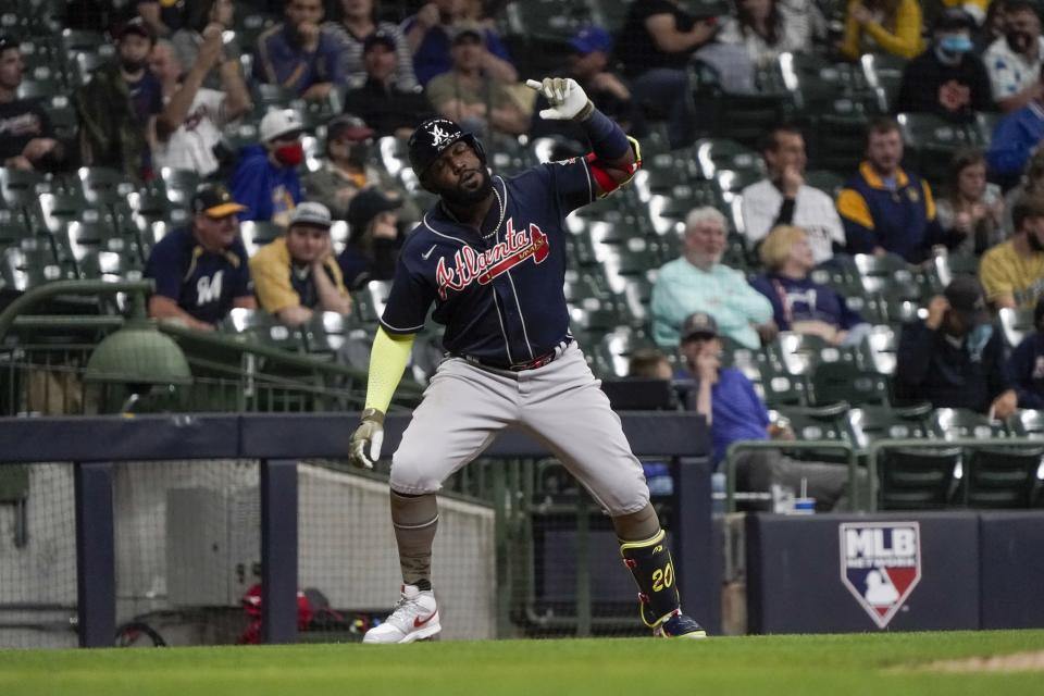 Atlanta Braves' Marcell Ozuna pauses at third after hitting a home run during the fifth inning of a baseball game against the Milwaukee Brewers Friday, May 14, 2021, in Milwaukee. (AP Photo/Morry Gash)