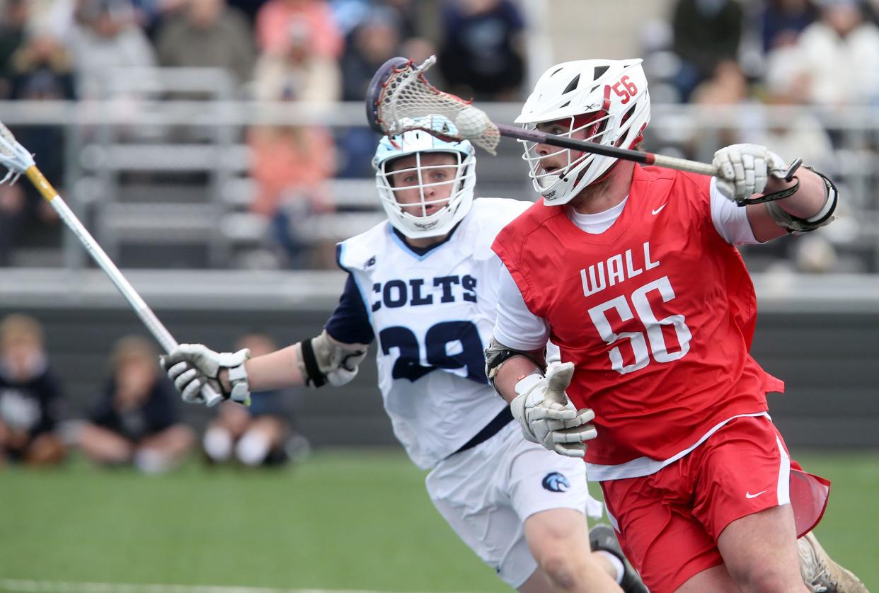 Wall's Robert Langworthy (#56) pushes arouund CBA's John Little (#29) during their game in Middletown Wednesday, April 10, 2024.