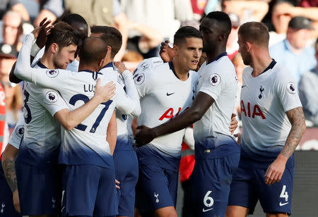 Soccer Football - Premier League - West Ham United v Tottenham Hotspur - London Stadium, London, Britain - October 20, 2018 Tottenham's Erik Lamela celebrates with team mates after scoring their first goal REUTERS/David Klein