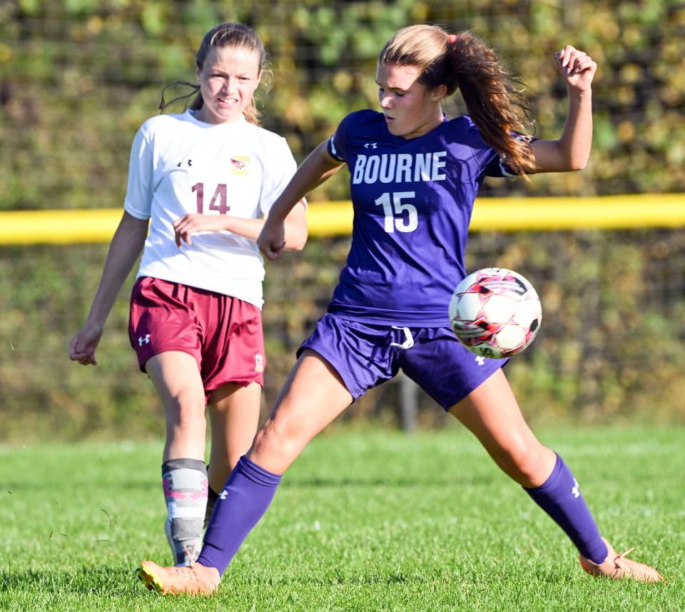 Taylor Simard of Bourne stretches to control the ball in front of Katelyn Bettencourt of Case.