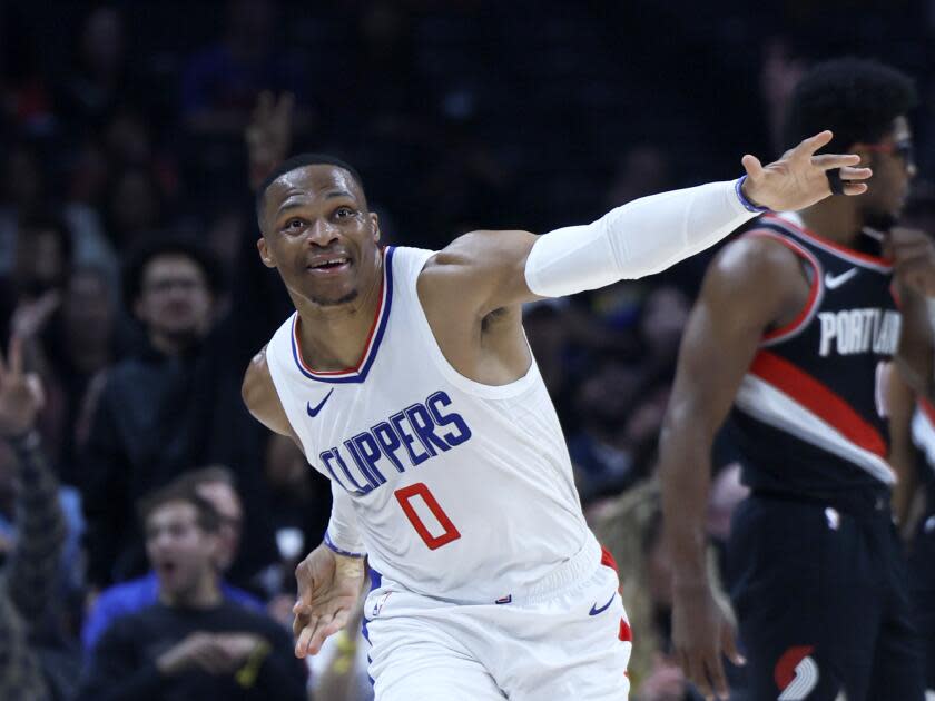 Clippers guard Russell Westbrook celebrates after shooting a three-pointer against the Trail Blazers in the first half.