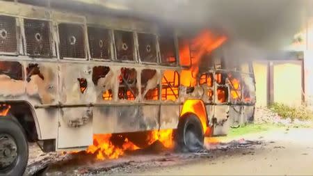 A bus on fire is seen during a protest against the construction of a copper smelter by Vedanta Resources, in Thoothukudi, Tamil Nadu, India in this still image from May 23, 2018 video footage. ANI via REUTERS TV