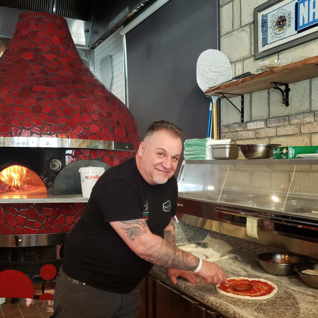 Chef Pasquale making a pizza at his South Kingstown restaurant that is No. 12 on the list of the 50 best pizzerias in the United State.
