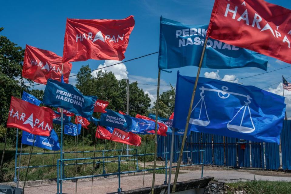 Barisan Nasional, Perikatan Nasional and Pakatan Harapan flags are picture along Jalan Sg Udang in Melaka November 14, 2021. — Picture by Shafwan Zaidon