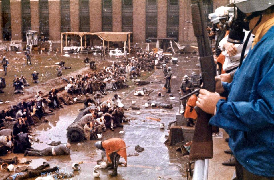 New York state police in riot gear regain control after the Attica prison riot in September 1971.