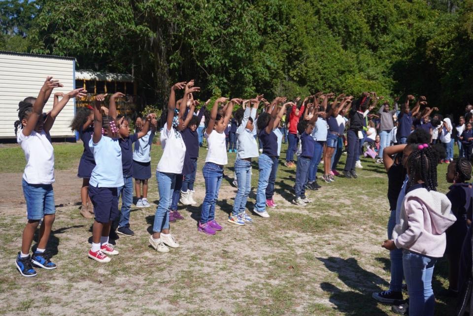 The Soaring Dancing Eagles, comprised of students from all grade levels at Caring and Sharing Learning School in Gainesville, dance to Michael Jackson’s Man in the Mirror during an Earth Day program at the school on Monday.
(Credit: Photo provided by Voleer Thomas)