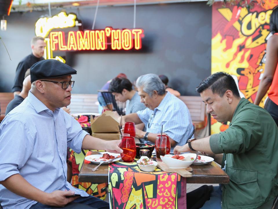 Guests attend The Flamin Hot Spot, Cheetos new limited-time restaurant with a menu inspired by chef Roy Choi at Madera Kitchen on September 19, 2018 in Hollywood, California.