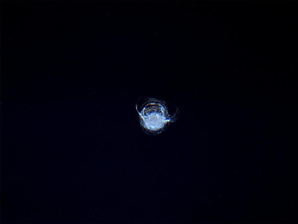 A chip in the ISS cupola taken by Astronaut Tim Peake is seen on a dark background