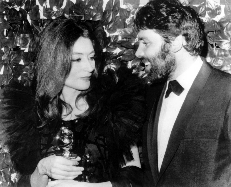 FILE - French actress Anouk Aimee poses with her husband, Lyricist Pierre Baruch, in Hollywood last night after the Hollywood foreign press association named her best actress of the year at the group's annual Golden Globes Awards Banquet. She won in the Drama Category for her role in "A man and a woman" on Feb. 1967..The film was named best foreign language film of the Year. French actress Anouk Aimée, winner of a Golden Globe for her starring role in "A Man and a Woman" by legendary French director Claude Lelouch, has died, her agent said Tuesday June 18, 2024. She was 92. (AP Photo, File)