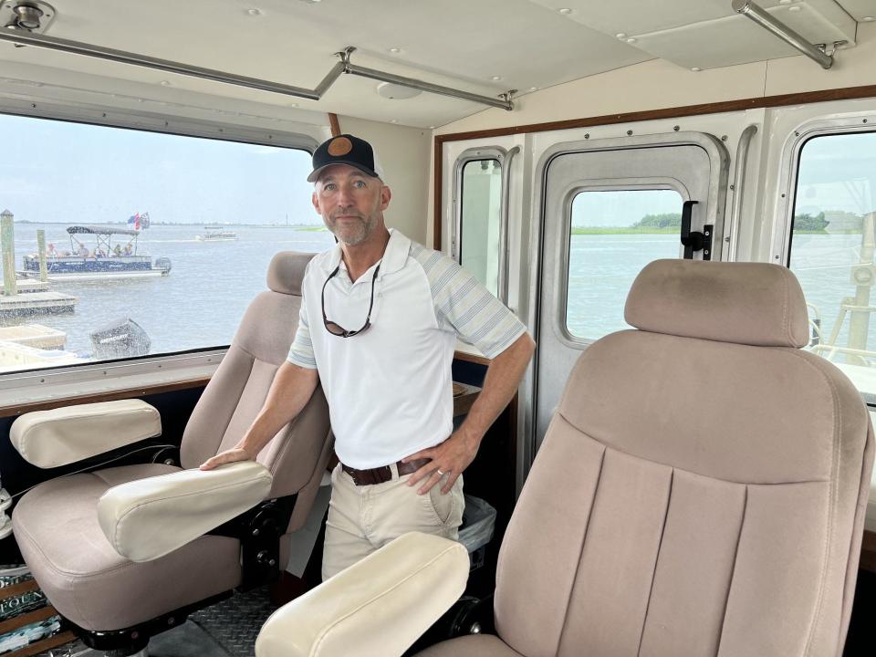 Scott Aldridge, Southport native and a Cape Fear River pilot, stands on the Pilot boat before making his next trip out on Wednesday, July 12, 2023.