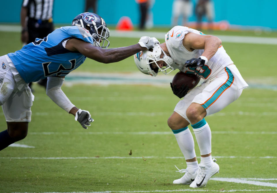 <p>Tennessee Titans Cornerback LeShaun Sims (36) tries to tackle Miami Dolphins Wide Receiver Danny Amendola (80) by yanking on the back of his helmet during the NFL football game between the Tennessee Titans and the Miami Dolphins on September 9, 2018, at the Hard Rock Stadium in Miami Gardens, FL. (Photo by Doug Murray/Icon Sportswire via Getty Images) </p>