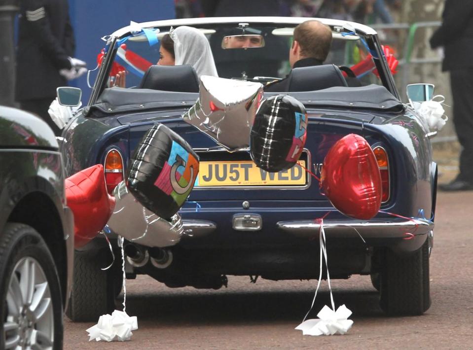 Prince William and Kate Middleton in their getaway car on their wedding day in April 2011