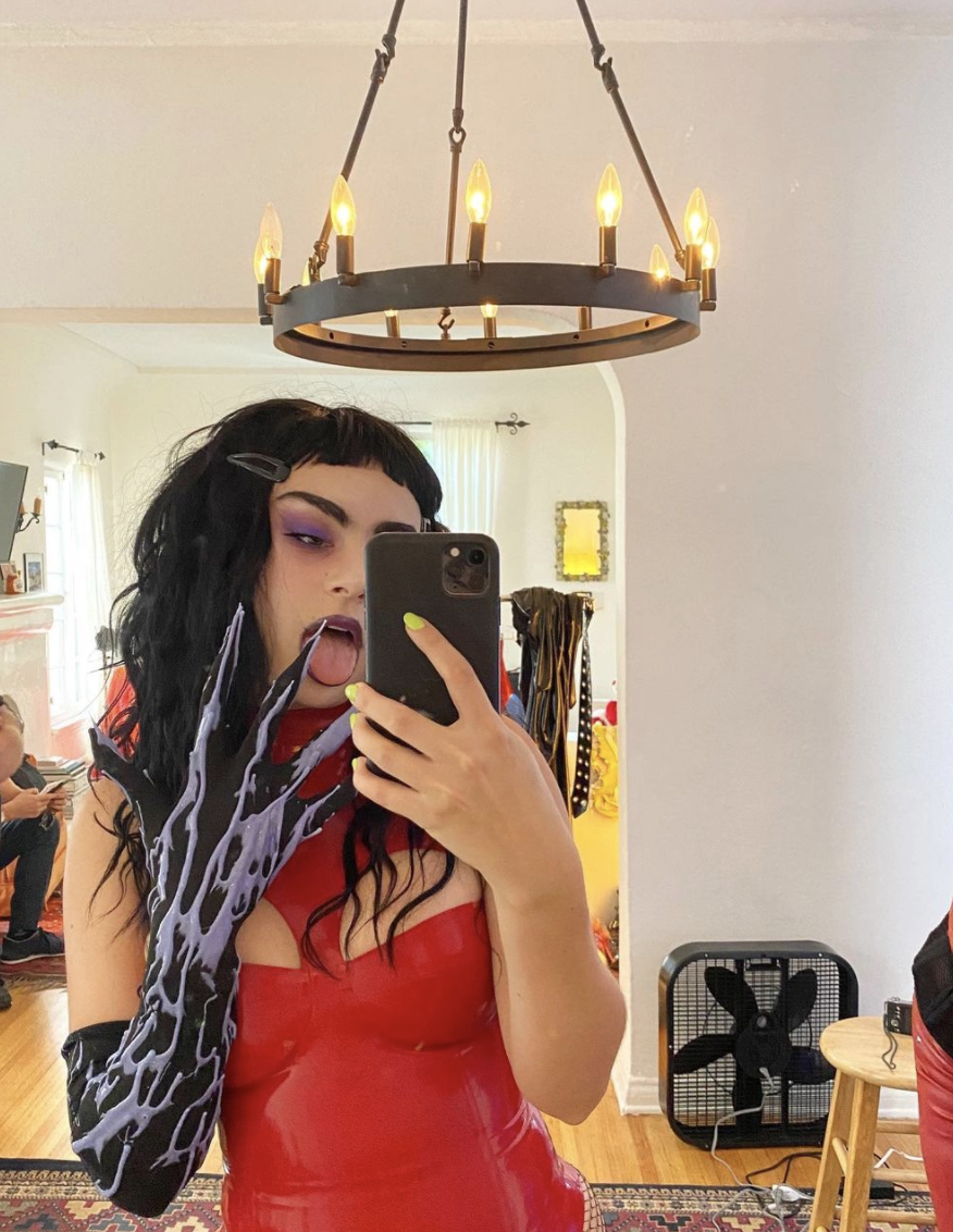 <p>As a Halloween vixen.</p><p>Charli XCX posted <a href="https://www.instagram.com/p/CGyJVZTHsIU/" rel="nofollow noopener" target="_blank" data-ylk="slk:this look on her Instagram;elm:context_link;itc:0;sec:content-canvas" class="link ">this look on her Instagram</a> on October 25, writing, "😈 spooky szn is beginning! 😈 make sure u check out <a href="https://www.instagram.com/bennydrama7/" rel="nofollow noopener" target="_blank" data-ylk="slk:@bennydrama7;elm:context_link;itc:0;sec:content-canvas" class="link ">@bennydrama7</a>’s Night Of Horror ft me and a load of other icons (including drew barrymore OMG dead) TONIGHT!"</p>