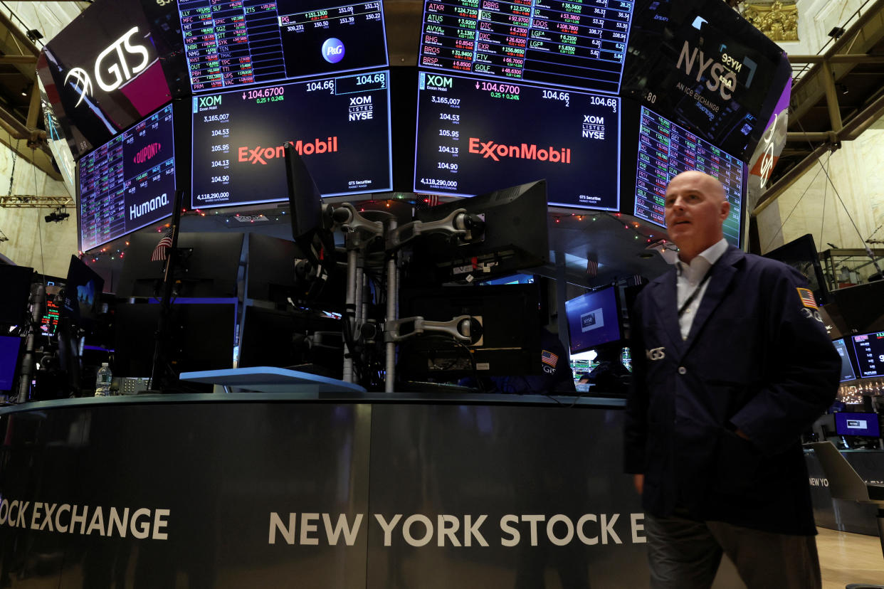 Screens display the trading information for ExxonMobil on the floor of the New York Stock Exchange (NYSE) in New York City, U.S., December 9, 2022.  REUTERS/Brendan McDermid