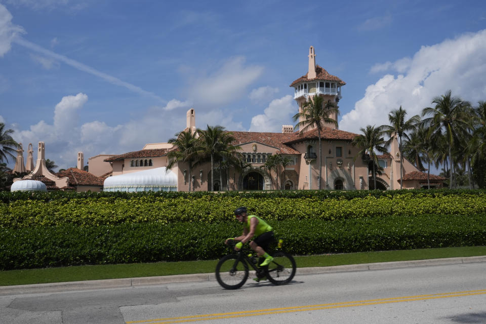 A cyclist passes Mar-a-Lago, as former President Donald Trump is planning to meet Hungarian Prime Minister Victor Orban, Friday, March 8, 2024, in Palm Beach, Fla. (AP Photo/Marta Lavandier)