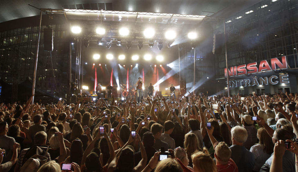 Eric Church performs on an outdoor stage during the CMT Music Awards show on Wednesday, June 6, 2012, in Nashville, Tenn. (AP Photo/Mark Humphrey)