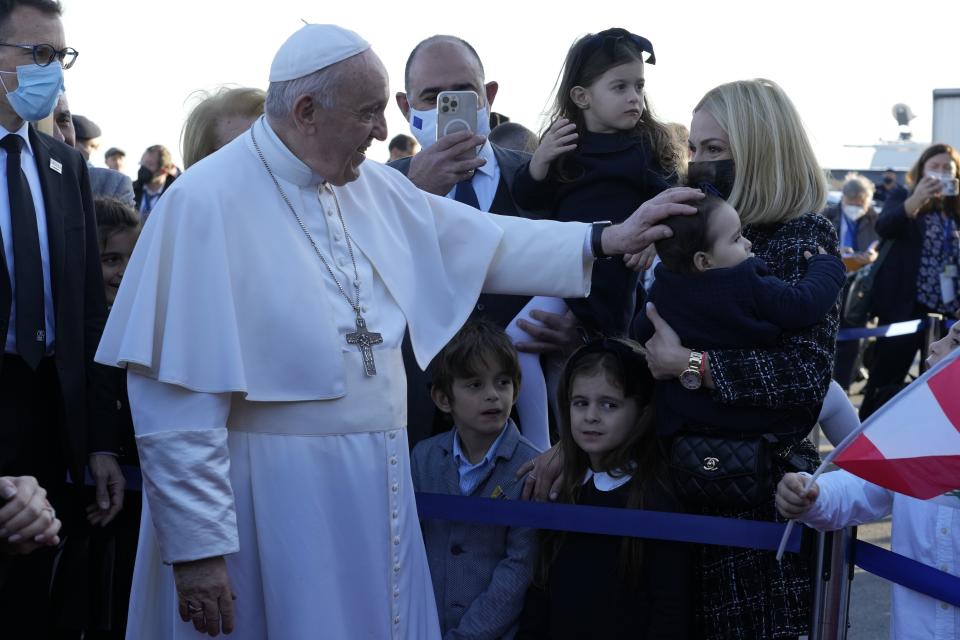 Pope Francis arrives at the airport in Larnaca, Cyprus, Thursday, Dec. 2, 2021. Pope Francis' trip to Cyprus and Greece is drawing new attention to the plight of migrants on Europe's borders and the disconnect between Francis' Gospel-driven call for countries to welcome and integrate them and front-line governments that are increasingly unwilling or unable to let them in. (AP Photo/Alessandra Tarantino)